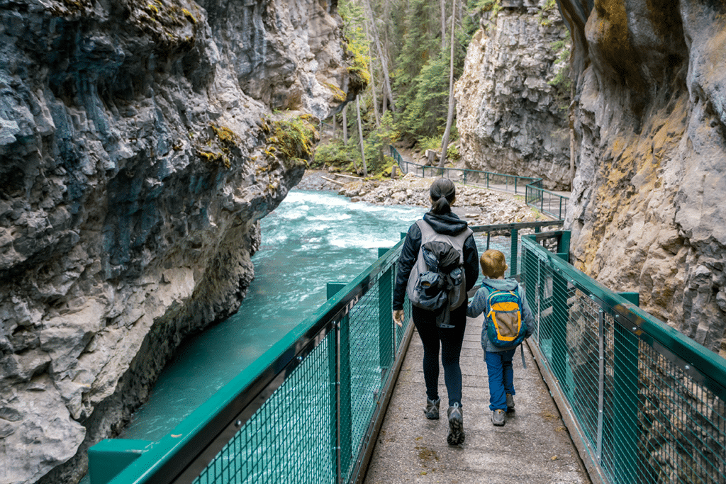 Top 5 Family-Friendly Hiking Trails in Canada 1 Mother and Son Hiking at Johnson Canyon in Banff National Park, Canada